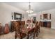 Formal dining room boasts wood floors, elegant lighting, and wet bar for sophisticated entertaining at 7522 S Mount Zirkel, Littleton, CO 80127