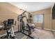 Brightly lit home gym with window and workout equipment at 7522 S Mount Zirkel, Littleton, CO 80127