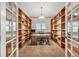 Inviting home office featuring custom built-in bookshelves at 7522 S Mount Zirkel, Littleton, CO 80127