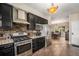 Well-appointed kitchen with stainless steel appliances and adjacent dining area for convenient meals at 7522 S Mount Zirkel, Littleton, CO 80127