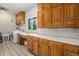 Spacious laundry room with wooden cabinets and countertops at 7522 S Mount Zirkel, Littleton, CO 80127
