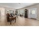 Elegant living room featuring hardwood floors, a front door with glass, and traditional furniture for a refined atmosphere at 7522 S Mount Zirkel, Littleton, CO 80127