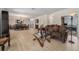 Open concept living room featuring hardwood floors and combined dining area, ideal for entertaining and Gathering gatherings at 7522 S Mount Zirkel, Littleton, CO 80127