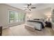 Serene bedroom with natural light, ceiling fan, and neutral decor, perfect for restful nights at 7522 S Mount Zirkel, Littleton, CO 80127