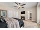 Cozy main bedroom with fireplace, ceiling fan, and ensuite bathroom for ultimate privacy at 7522 S Mount Zirkel, Littleton, CO 80127