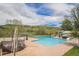 Community pool area featuring a large swimming pool with a water slide and mountain views at 7522 S Mount Zirkel, Littleton, CO 80127