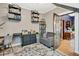 A ' bedroom with a desk and shelves, featuring a chair, an area rug, and a view through an open door at 2236 Forest St, Denver, CO 80207