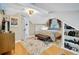 Bedroom with hardwood floors, comfortable bed, and unique decor elements at 2236 Forest St, Denver, CO 80207
