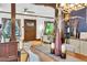 Open-concept dining area connects seamlessly to living space, showcasing hardwood floors, modern lighting, and stylish furnishings at 2236 Forest St, Denver, CO 80207