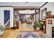 Spacious dining room with hardwood floors, modern chandelier, dark blue walls, natural light, and stylish decor at 2236 Forest St, Denver, CO 80207