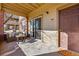Covered patio with comfy seating area located by sliding glass door to unit #103 at 12924 Ironstone Way # 103, Parker, CO 80134