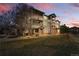 Three-story apartment building with multiple balconies and attractive landscaping at 12924 Ironstone Way # 103, Parker, CO 80134