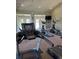 Modern gym equipment includes a treadmill and elliptical machines, and big screen for entertainment at 12924 Ironstone Way # 103, Parker, CO 80134
