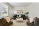 Cozy living room features a neutral color palette, plush sofa, and ample natural light at 12924 Ironstone Way # 103, Parker, CO 80134