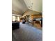 Open concept kitchen and living room area with bar seating and plenty of space to entertain at 12924 Ironstone Way # 103, Parker, CO 80134