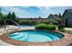 Community hot tub, pool, and lounge area with lawn at 12924 Ironstone Way # 103, Parker, CO 80134