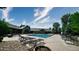 Gorgeous pool area with lounge chairs and beautiful landscaping, perfect for relaxing on a hot day at 12924 Ironstone Way # 103, Parker, CO 80134