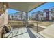 Inviting covered balcony area with view of the community landscape and townhomes at 11225 Colony Cir, Broomfield, CO 80021