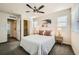 This bedroom has a ceiling fan, soft carpet, a closet, and neutral decor at 11225 Colony Cir, Broomfield, CO 80021