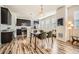 Open-concept kitchen with stainless steel appliances, a dining table, and an adjacent living area at 11225 Colony Cir, Broomfield, CO 80021