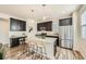 Modern kitchen featuring stainless steel appliances, a large island, and a dedicated workspace at 11225 Colony Cir, Broomfield, CO 80021