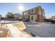 Large backyard with concrete patio and snow covering the ground at 3012 S Jericho Way, Aurora, CO 80013