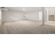 Finished basement with neutral carpeting and ample space at 3012 S Jericho Way, Aurora, CO 80013