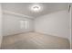 Finished basement bedroom with window and neutral carpeting at 3012 S Jericho Way, Aurora, CO 80013