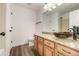 Bathroom with granite countertop, vessel sink, and updated flooring at 3012 S Jericho Way, Aurora, CO 80013