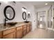 Bathroom with double vanity, granite countertop, and walk-in shower at 3012 S Jericho Way, Aurora, CO 80013