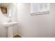 Clean and simple bathroom with pedestal sink and large mirror at 3012 S Jericho Way, Aurora, CO 80013