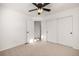 Spacious bedroom with double-door closet and ceiling fan at 3012 S Jericho Way, Aurora, CO 80013
