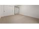 Spacious bedroom with plush carpeting and double doors leading to closet at 3012 S Jericho Way, Aurora, CO 80013