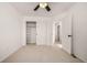 Bright bedroom with ceiling fan, open shelving and large closet at 3012 S Jericho Way, Aurora, CO 80013