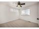 Bright bedroom with ceiling fan, large closet and neutral carpeting at 3012 S Jericho Way, Aurora, CO 80013