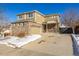 Two-story house with brick and siding, two-car garage, and covered porch at 3012 S Jericho Way, Aurora, CO 80013