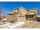 Two-story house with brick and siding, two-car garage, and covered porch at 3012 S Jericho Way, Aurora, CO 80013