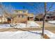 Two-story house with brick and siding, two-car garage, and covered porch at 3012 S Jericho Way, Aurora, CO 80013