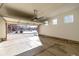 Attached garage with open door, offering views of the neighborhood at 3012 S Jericho Way, Aurora, CO 80013