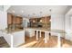 Large kitchen with granite countertops and wooden cabinets at 3012 S Jericho Way, Aurora, CO 80013