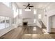 Two-story living room with hardwood floors, fireplace, and lots of natural light at 3012 S Jericho Way, Aurora, CO 80013