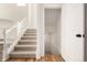 Carpeted staircase with white railing leading to the upper level at 3012 S Jericho Way, Aurora, CO 80013