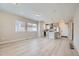 Sunlit open floor plan featuring modern kitchen with a large island, and spacious living area at 6906 Kendrick Ln, Arvada, CO 80007