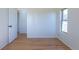 Bedroom with hardwood floors, natural light, a door, and white trim for a clean look at 1411 S Welch Cir, Lakewood, CO 80228