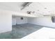 Clean, painted garage with storage and an updated garage door opener at 1411 S Welch Cir, Lakewood, CO 80228