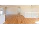 Bright living room featuring hardwood floors and a stairway with white railing at 1411 S Welch Cir, Lakewood, CO 80228