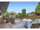 Charming backyard deck with outdoor seating and a lovely view of the neighborhood at 2176 S Welch Cir, Lakewood, CO 80228