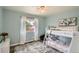 Cozy bedroom with soft blue walls, hardwood floors and white bunk beds at 2176 S Welch Cir, Lakewood, CO 80228