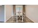 Dining room featuring a modern table, neutral walls, and sleek wood-look flooring at 2176 S Welch Cir, Lakewood, CO 80228