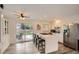 Bright kitchen with stainless appliances, quartz island, and a view of outdoor deck at 2176 S Welch Cir, Lakewood, CO 80228